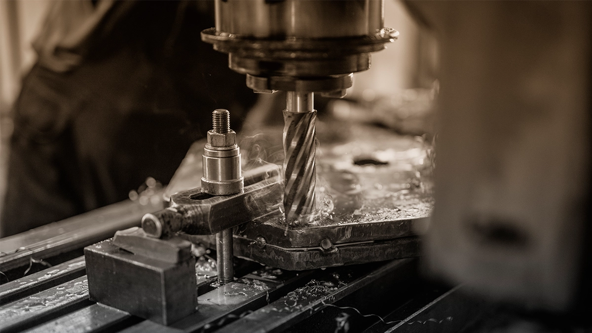 A CNC milling machine cutting a metal part